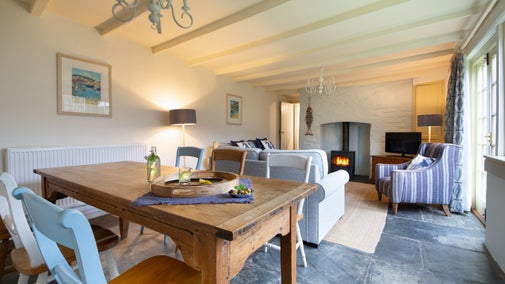 The sitting and dining room at The White Cottage, Cornwall